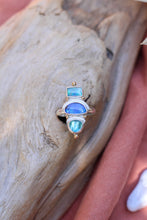 Load image into Gallery viewer, Ring with opal and apatite gemstones on a wooden surface