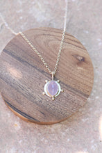Load image into Gallery viewer, Necklace with a purple chalcedony pendant on a wooden coaster