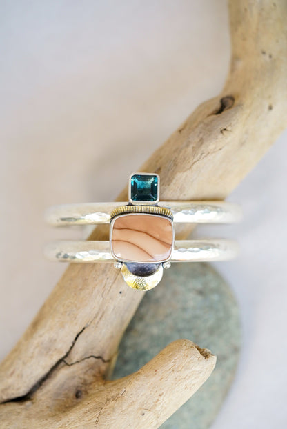 statement cuff with jasper and blue fluorite on a piece of driftwood