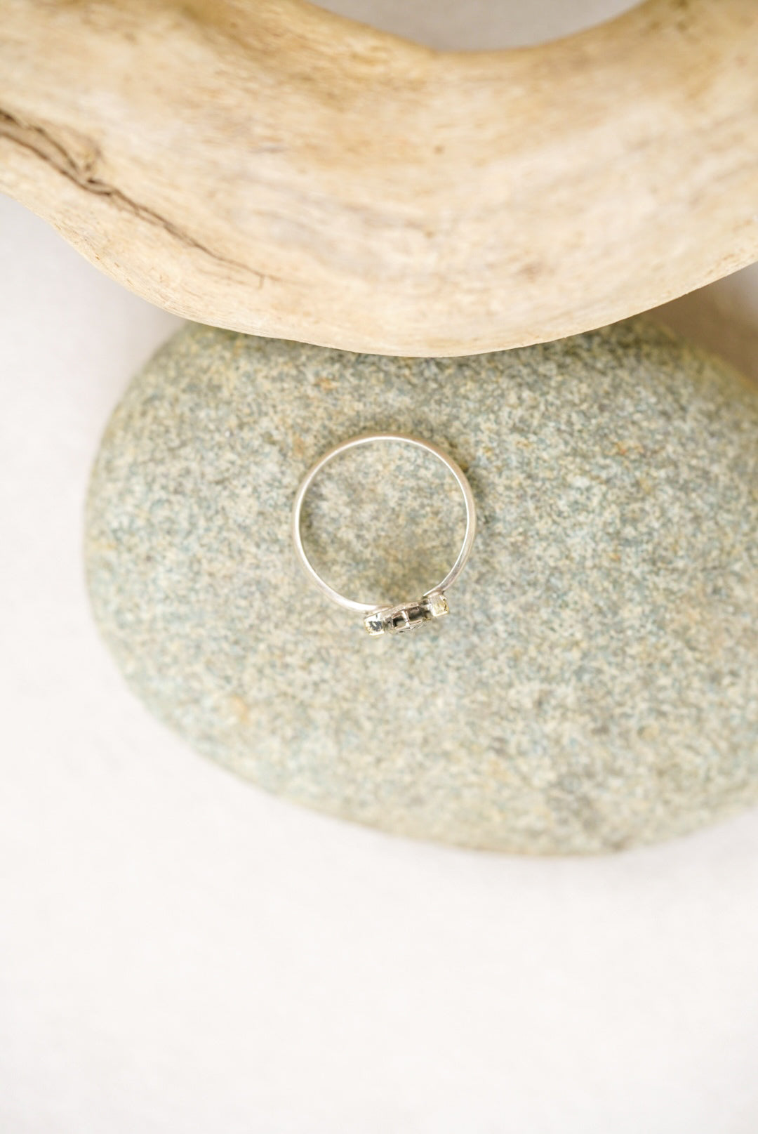 Silver ring on a pebble