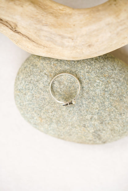 Silver ring on a pebble