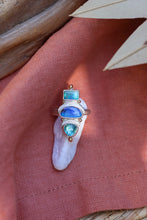 Load image into Gallery viewer, Ring with opal and apatite stones on a pink fabric background
