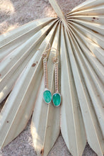 Load image into Gallery viewer, Green earrings on a leaf with a natural background
